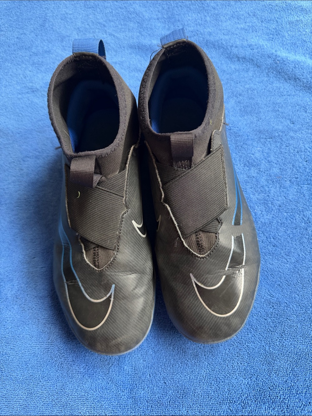 Nike Kids Black Slip-On Sneakers with Blue Accents